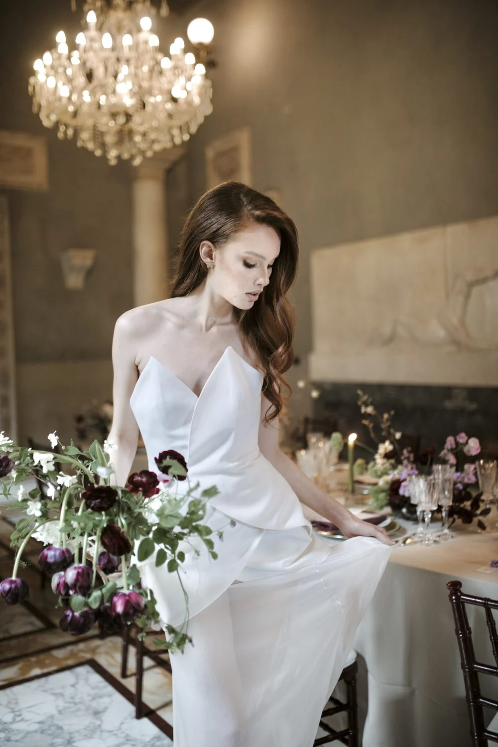 Bride holding a loose garden bouquet in soft cream and blush