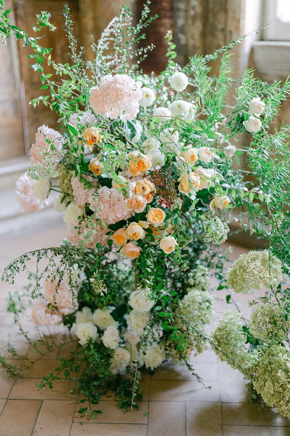 Close view of roses and ranunculus in a bridal bouquet