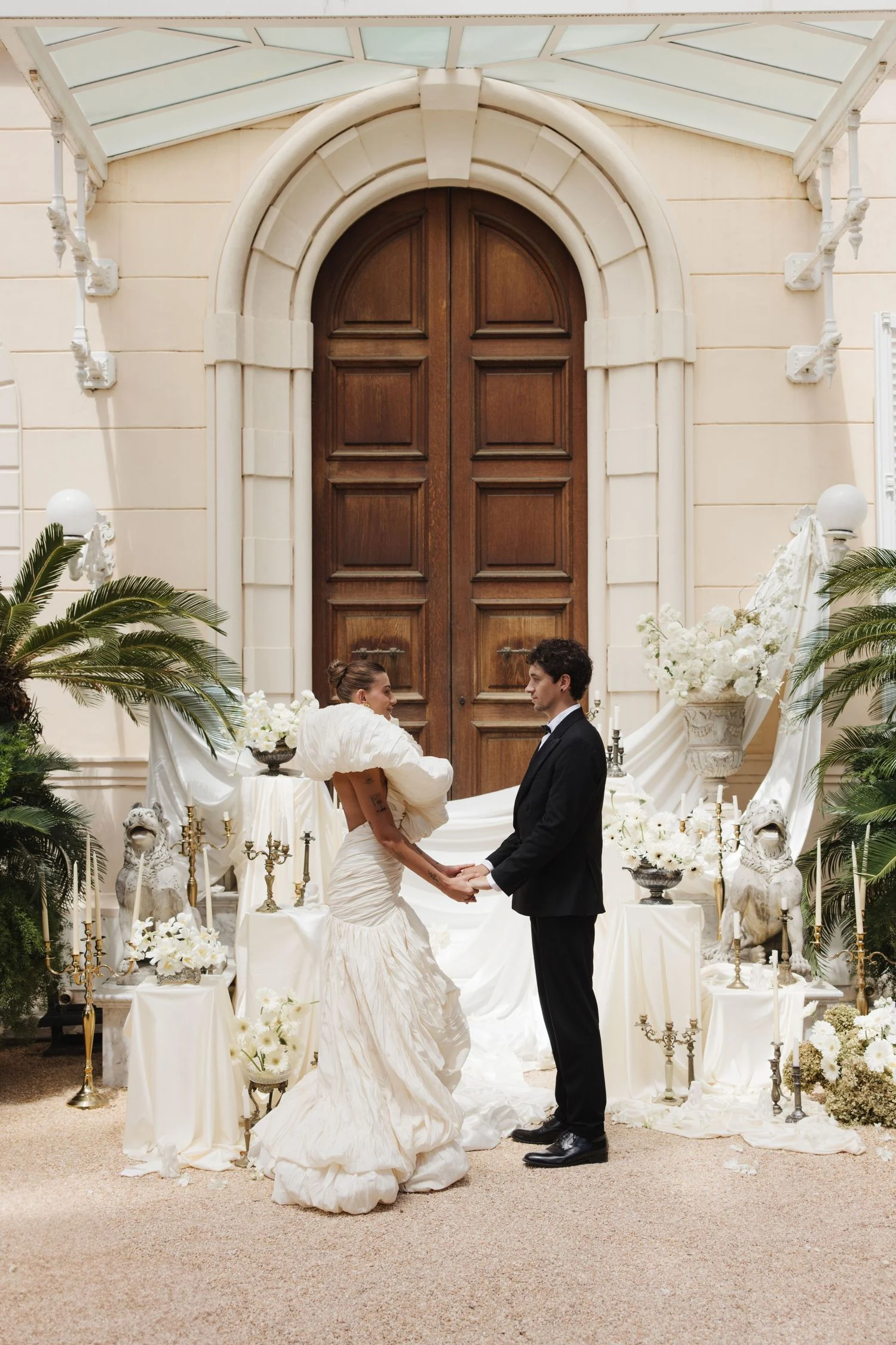 Villa Astor editorial with bride and groom in a grand hallway.